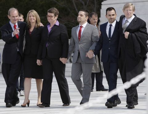 From left, attorney David Boies, plaintiffs Sandra Stier, Kris Perry, Jeff Zarrillo and Paul Katami, and attorney Theodore B. Olson exit together from the Supreme Court after their case against California's Proposition 8 was argued on Tuesday, March 26. 