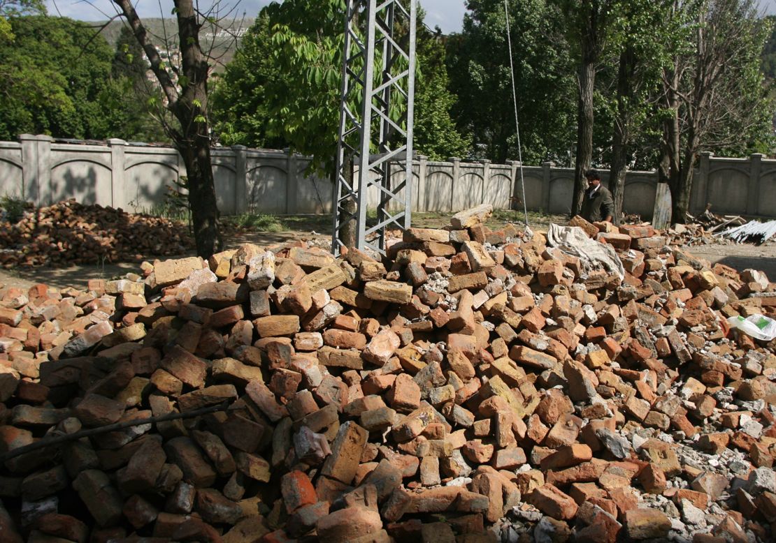 Shakeel Ahmad Yusufzai, a Pakistani contractor who worked to dismantle the compound, walks through the rubble left behind from the demolition on May 1, 2012.