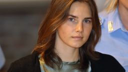 A photo of Amanda Knox being escorted to a hearing at Perugia's Court of Appeal on September 2011 in Perugia, Italy. 