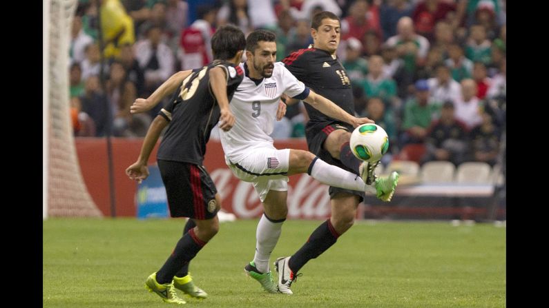  Javier Hernandez of Mexico fights for the ball with two U.S. players.