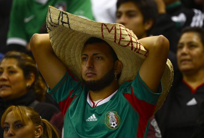 Mexico fans watch the game.