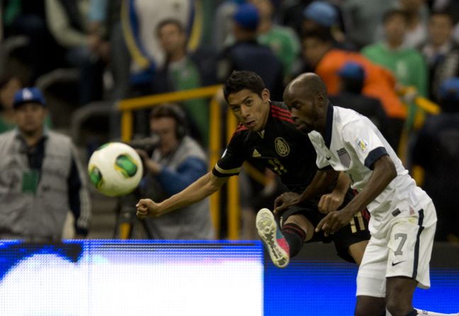 Mexico's Javier Aquino and U.S. defender DaMarcus Beasley  go to head to head for ball during their 2014 World Cup qualifying football match at Azteca Stadium in Mexico City on Tuesday, March 26. The regional rivals tied 0-0.