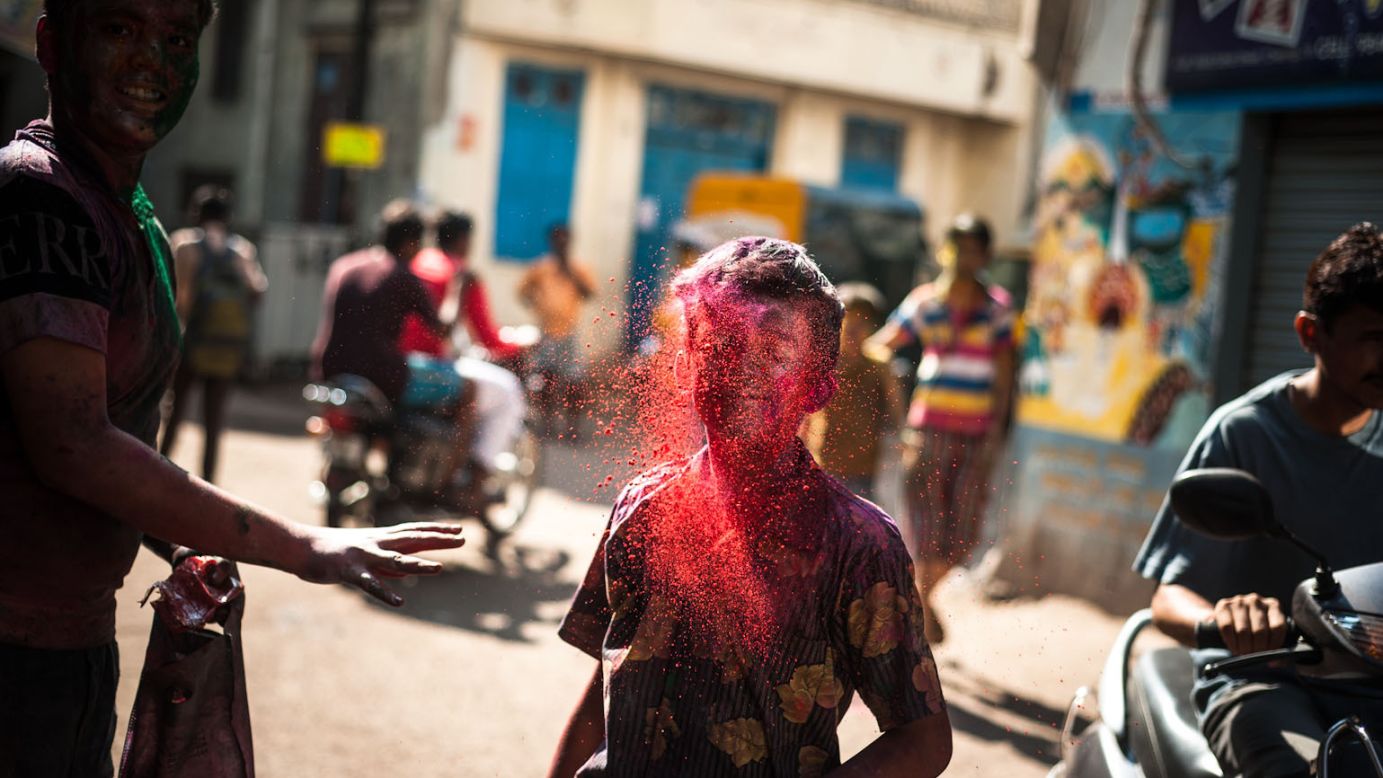 A young boy is engulfed in red powder by a friend as Holi celebrations hit the streets of Chennai, India, in this image by <a href="http://ireport.cnn.com/docs/DOC-947602" target="_blank">iReporter Ashok Saravanan</a>.