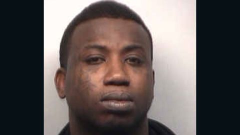Rapper Gucci Mane, here in a March booking photo, has been charged in federal court with gun crimes.