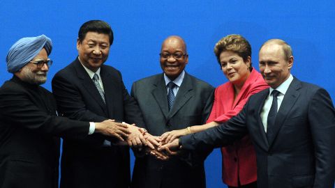 BRICS leaders (From L) India Prime minister Manmohan Singh, President of the People's Republic of China Xi Jinping, South Africa's President Jacob Zuma, Brazil's President Dilma Rousseff and Russian Federation President Vladimir Putin, pose for a family photo in Durban.
