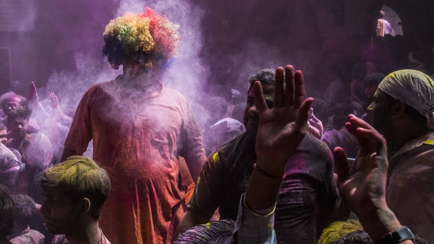 Celebrants throw colored powder on March 27 in Vrindavan.