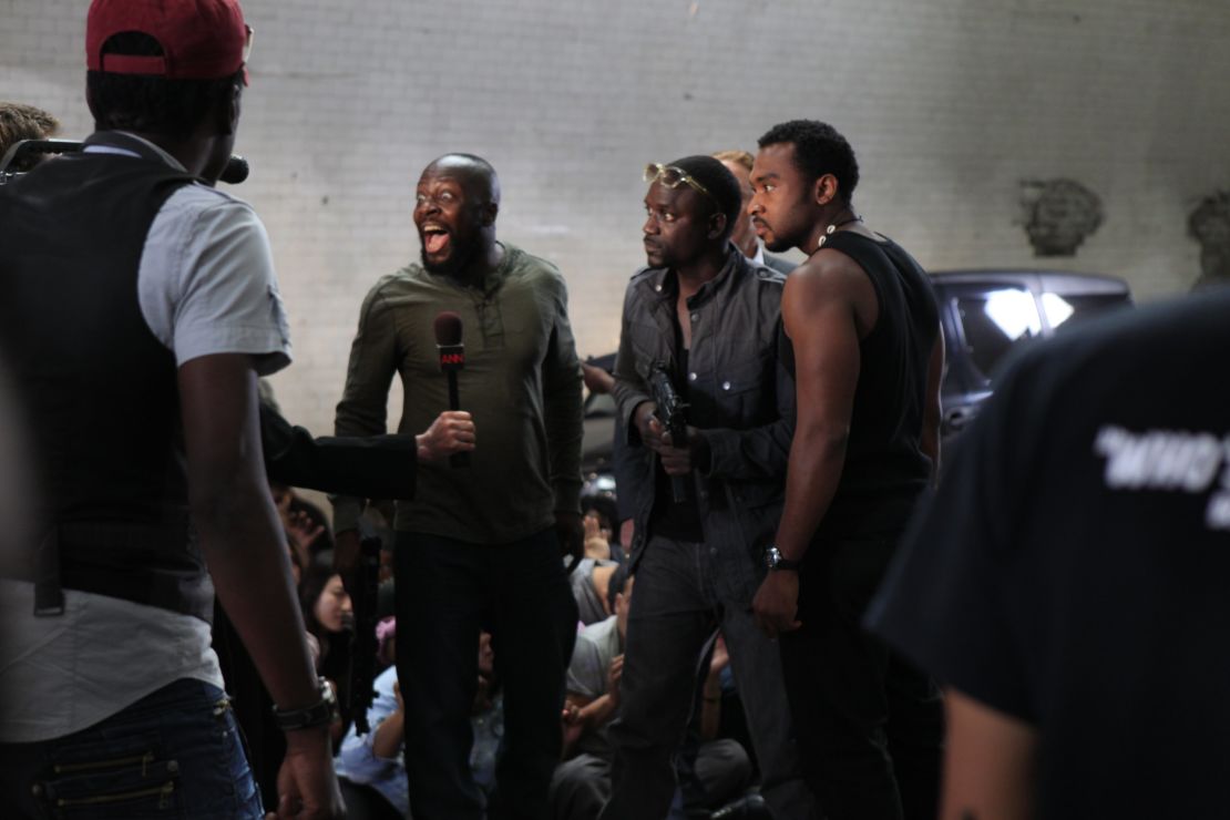 Musician Wyclef Jean and Akon on the set of Jeta Amata's film "Black November."