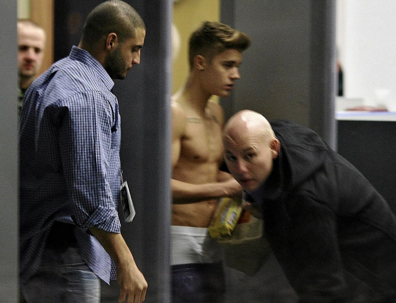 After he was <a href="http://marquee.blogs.cnn.com/2013/03/11/olivia-wilde-talks-beliebers-hilarious-abuse/">ragged on by Wilde</a> for going topless in London, Bieber strolled through a Polish airport terminal sans shirt on March 25, 2013.