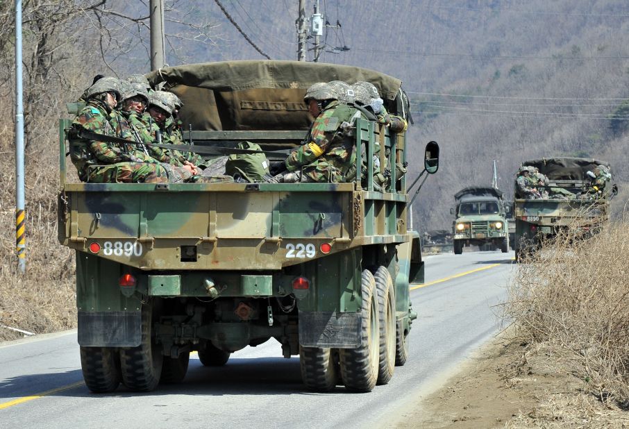 South Korean soldiers ride in a military truck in Paju on March 27.