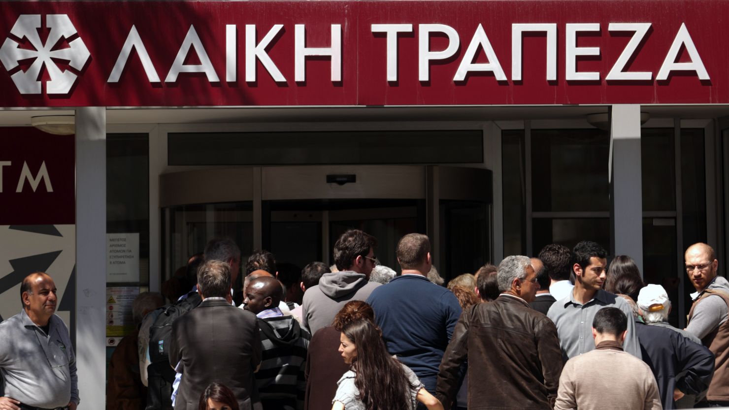 People queue up outside a Laiki bank branch in the Cypriot capital, Nicosia, on March 28.