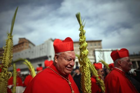 Cardinals proceed to the Obelisk as Pope Francis delivers his blessing of the palms during Palm Sunday Mass on March 24.