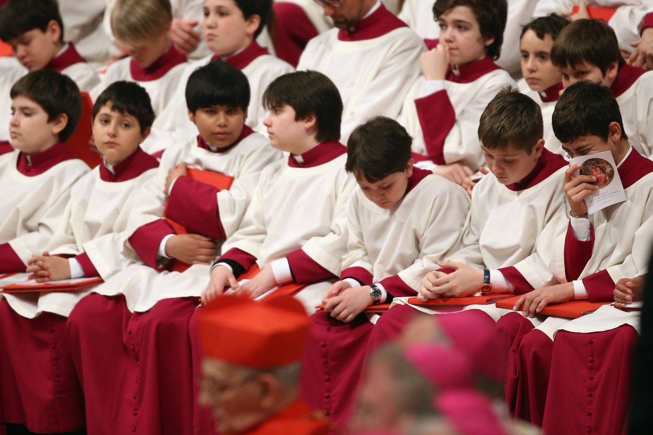 Choirboys fill a line of church benches on Thursday.