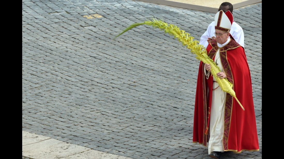 Pope Francis walks after blessing the palms on Palm Sunday.