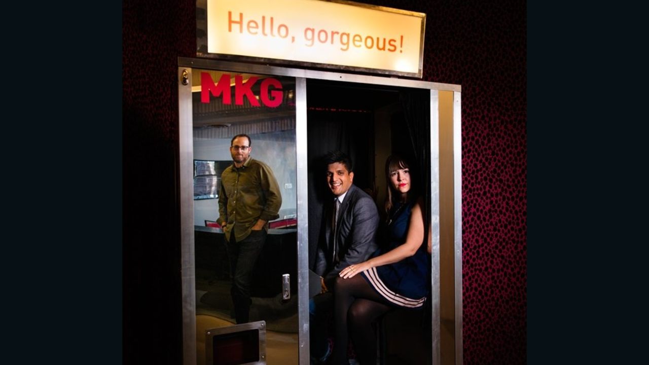 At marketing agency MKG, employees squeeze into their in-office photo booth.