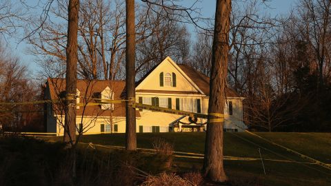 Police tape stretches across the front yard of the Lanza residence on December 19, 2012 in Newtown, Connecticut.