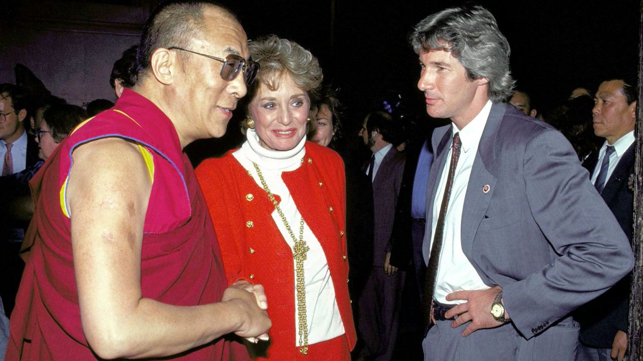 Walters shakes hands with the Dalai Lama when he visited New York in 1992. At right is actor Richard Gere.