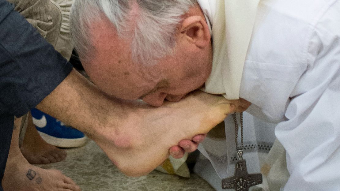 Pope Francis kisses the feet of a prisoner at the Casal Del Marmo Youth Detention Centre during the mass of the Lord's Supper on March 28, 2013 in Rome, Italy.