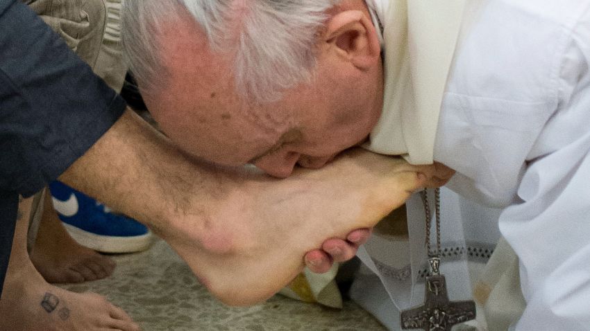 Pope Francis kisses the foot of a prisoner at the Casal Del Marmo Youth Detention Centre during the mass of the Lord's Supper on Thursday, March 28 in Rome, Italy.