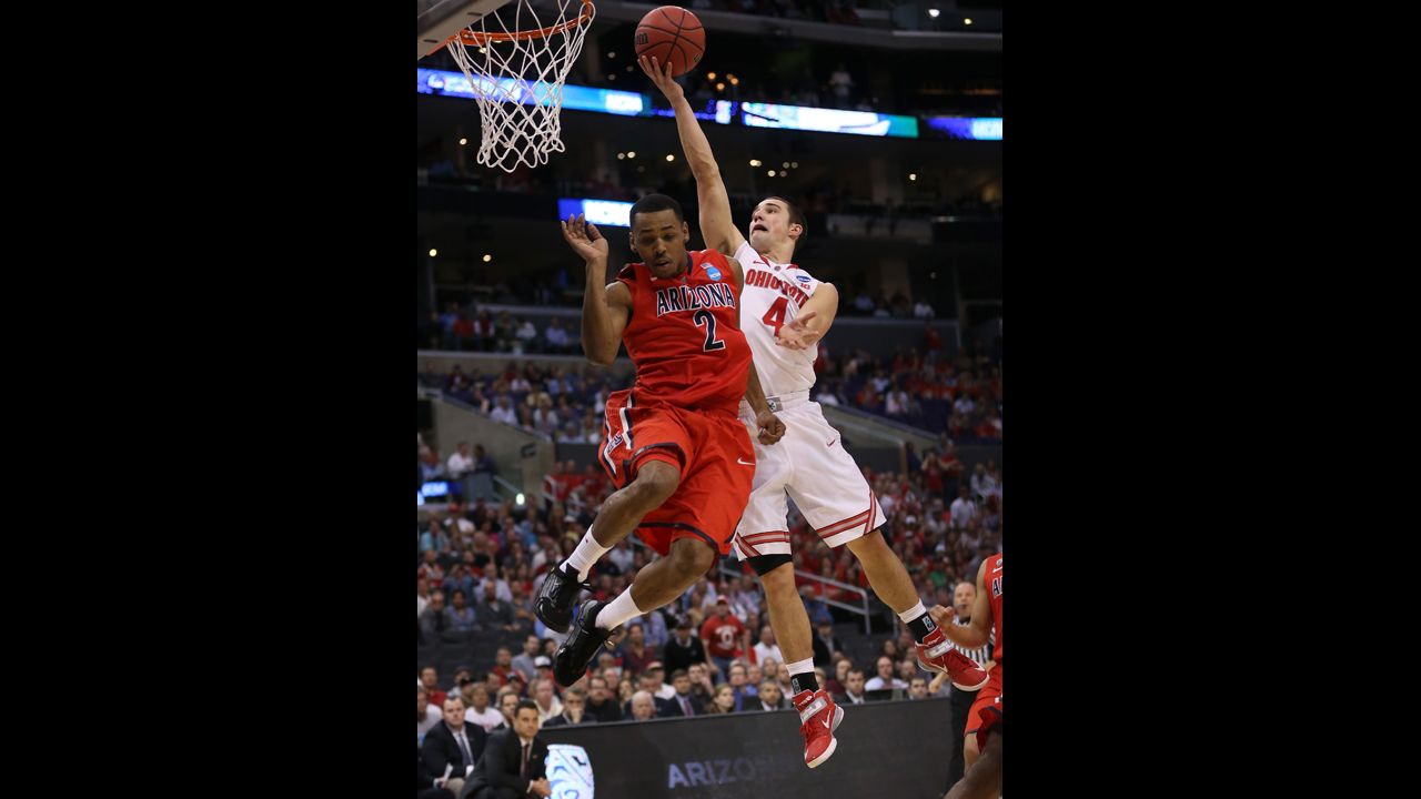 Aaron Craft of Ohio State goes up for a shot against Mark Lyons of Arizona on March 28.