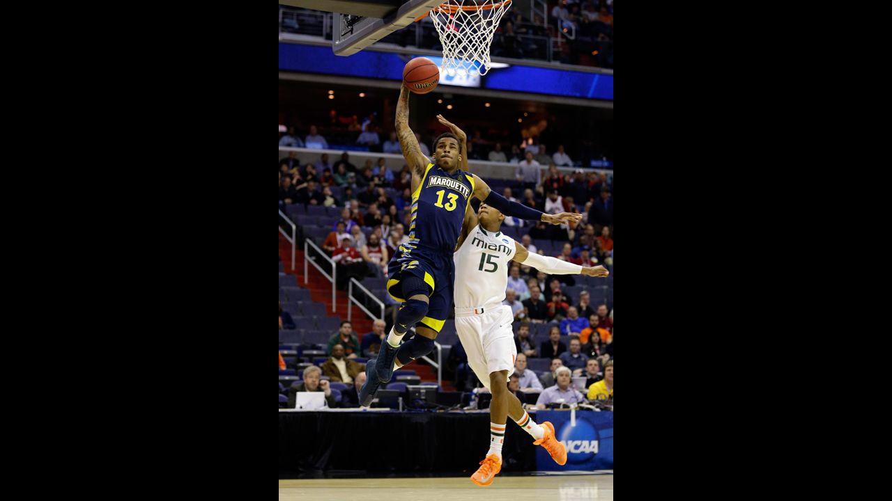 Vander Blue of Marquette goes to the hoop past Rion Brown of Miami on March 28 in Washington.