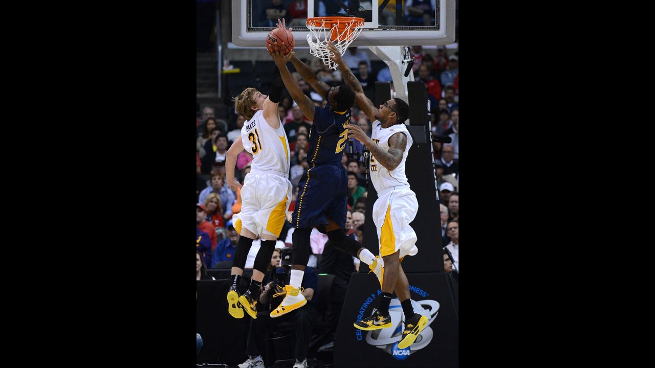 Jerrell Wright of La Salle goes up for a shot between Ron Baker, left, and Carl Hall, right, of Wichita State on March 28 in Los Angeles.