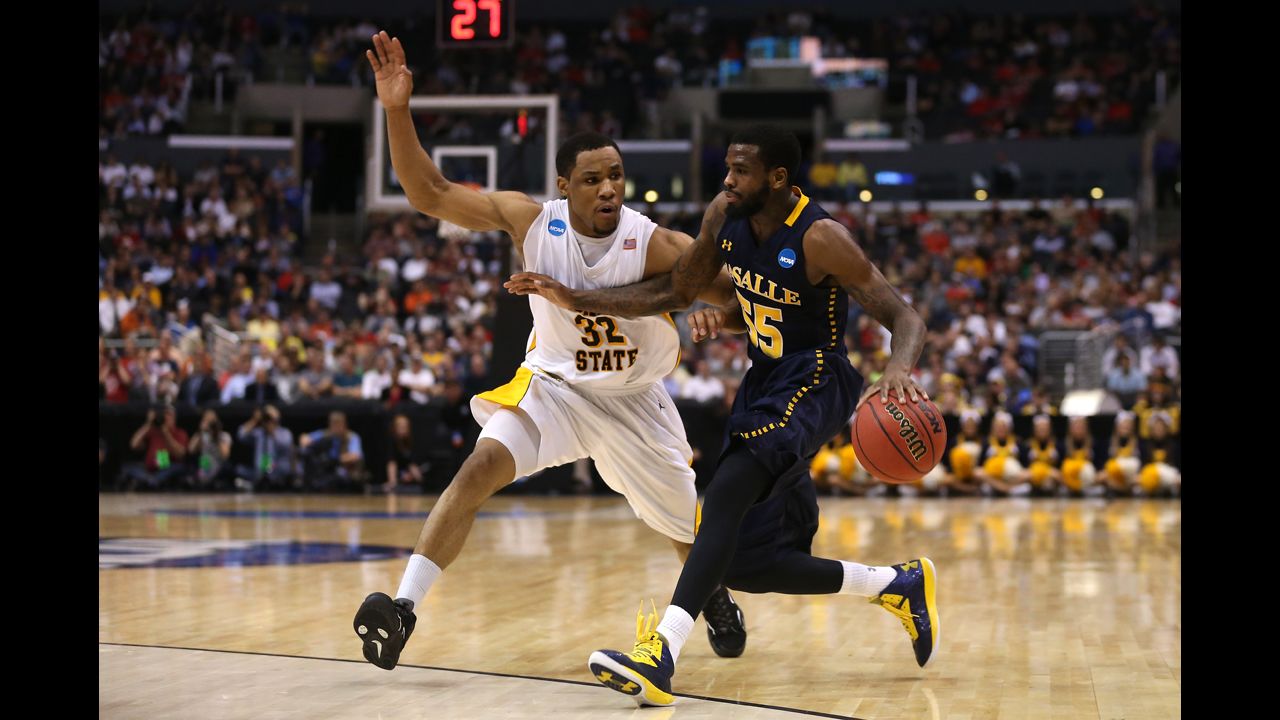 Ramon Galloway of La Salle drives on Tekele Cotton of Wichita State on March 28 in Los Angeles.