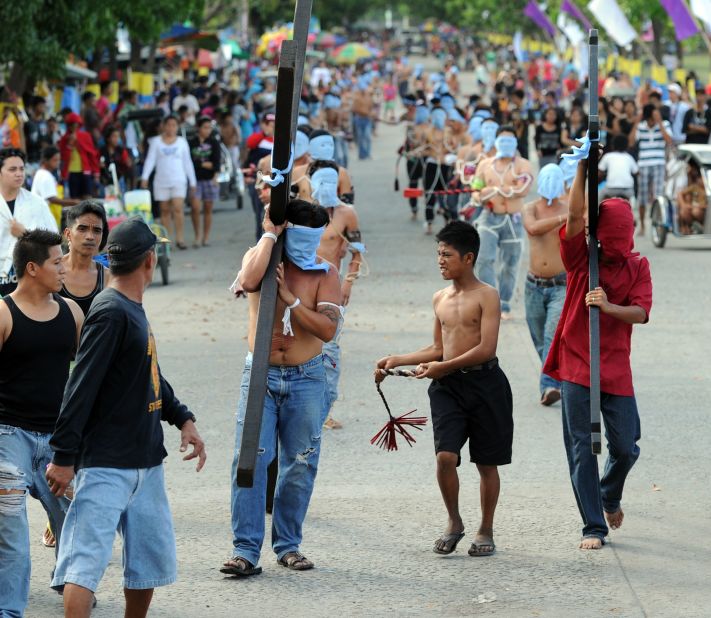 Penitents commemorate Jesus Christ's crucifixion and resurrection with self-flagellation, whipping their backs with wooden flails.