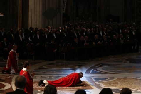 In an act of reverence, Pope Francis lies on floor of St. Peter's Basilica during Mass on Good Friday, in the Vatican.