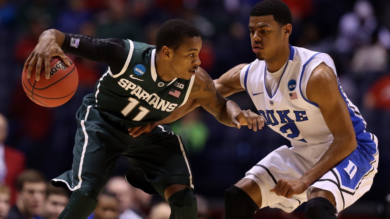Keith Appling of Michigan State looks to drive the ball against Quinn Cook of Duke on March 29.