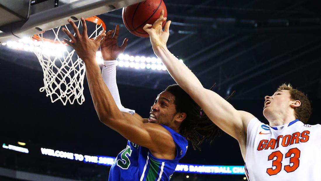 Erik Murphy of Florida, right, and Sherwood Brown of Florida Gulf Coast vie for a rebound on March 29.