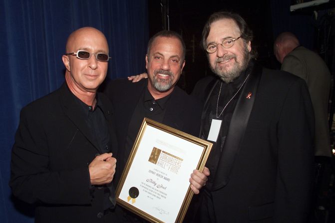 Music producer and innovator <a href="index.php?page=&url=http%3A%2F%2Fwww.cnn.com%2F2013%2F03%2F30%2Fshowbiz%2Fobit-phil-ramone%2Findex.html">Phil Ramone</a>, right, with Paul Shaffer, left, and Billy Joel at the Song Writers Hall of Fame Awards in New York in 2001. Ramone died March 30 at the age of 72.