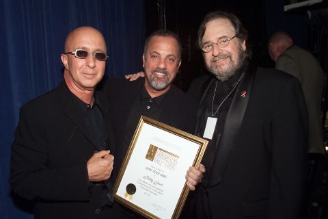 Music producer and innovator <a href="http://www.cnn.com/2013/03/30/showbiz/obit-phil-ramone/index.html">Phil Ramone</a>, right, with Paul Shaffer, left, and Billy Joel at the Song Writers Hall of Fame Awards in New York in 2001. Ramone died March 30 at the age of 72.