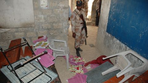 A Pakistani paramilitary soldier looks at a classroom following an attack by gunmen in Karachi on March 30.