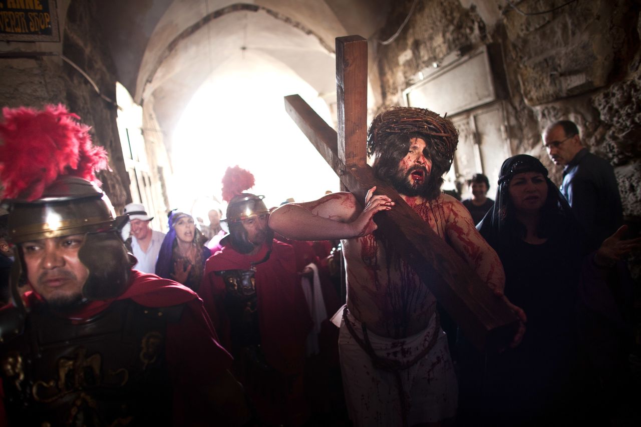 An American pilgrim from the Hope of Glory order re-enacts the passion of Christ during the Good Friday procession along the Via Dolorosa in Jerusalem.