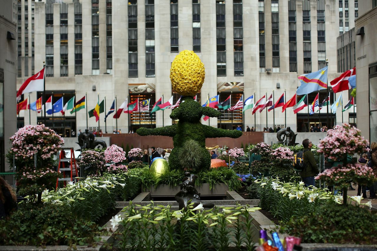 A 12-foot Easter Bunny topiary stands among white Easter lilies in New York's Rockefeller Center on Thursday.