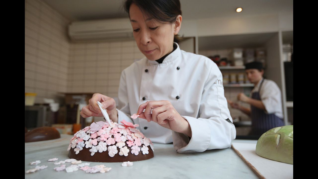 Head chocolatier Chika Watanabe decorates a limited edition Easter egg in the Melt chocolate shop in London on Thursday.
