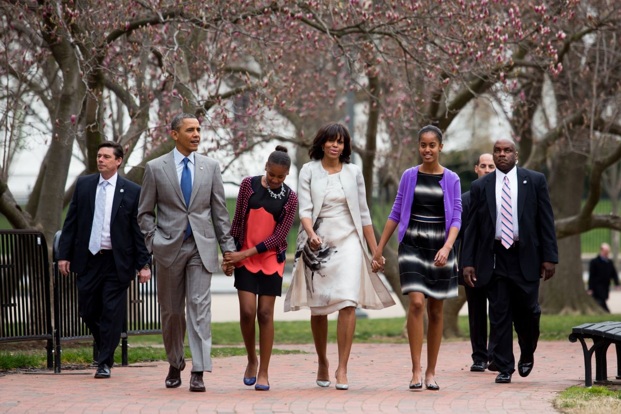 President Barack Obama, daughter Sasha, first lady Michelle Obama and daughter Malia walk across Lafayette Park from the White House on their way to Easter services at St. John's Episcopal Church on Sunday in Washington on March 31.