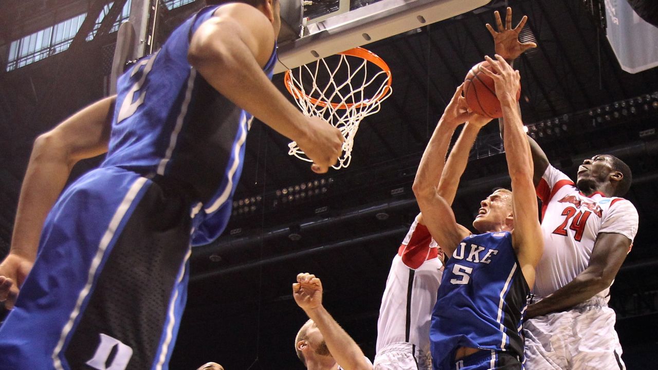 Mason Plumlee of Duke attempts a shot against Montrezl Harrell of Louisville on March 31.