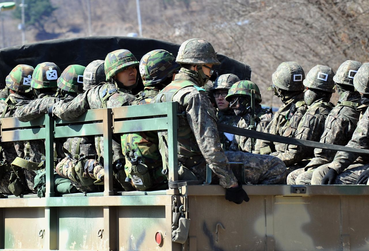 South Korean soldiers ride on a military truck in Paju on Friday, March 29.