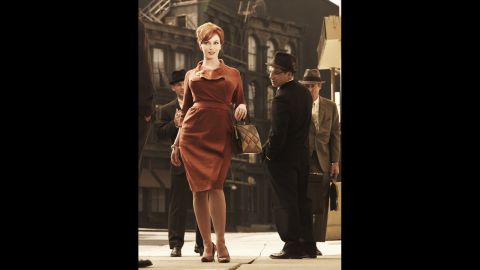 Joan attracts plenty of male attention in a flattering dress in season 3.