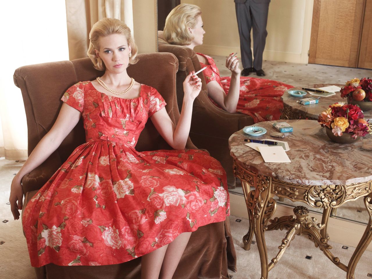 Betty lounges in season 4 of "Mad Men," set in 1964-65. 