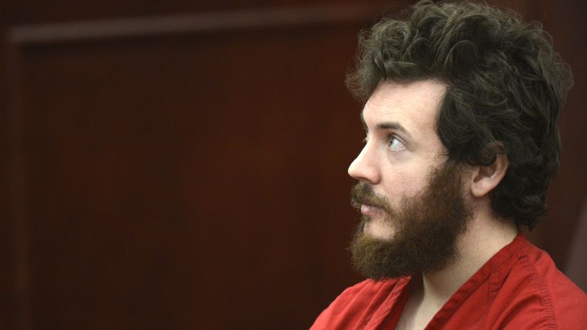 Accused Aurora theater shooting suspect James Holmes listens at his arraignment in Centennial, Colorado March 12, 2013. A Colorado judge presiding over the case of Holmes entered a not guilty plea on his behalf on Tuesday to charges that he went on a shooting spree nearly eight months ago that killed 12 moviegoers. REUTERS/R.J. Sangosti/Pool (UNITED STATES - Tags: CRIME LAW SOCIETY) REUTERS /POOL /LANDOV