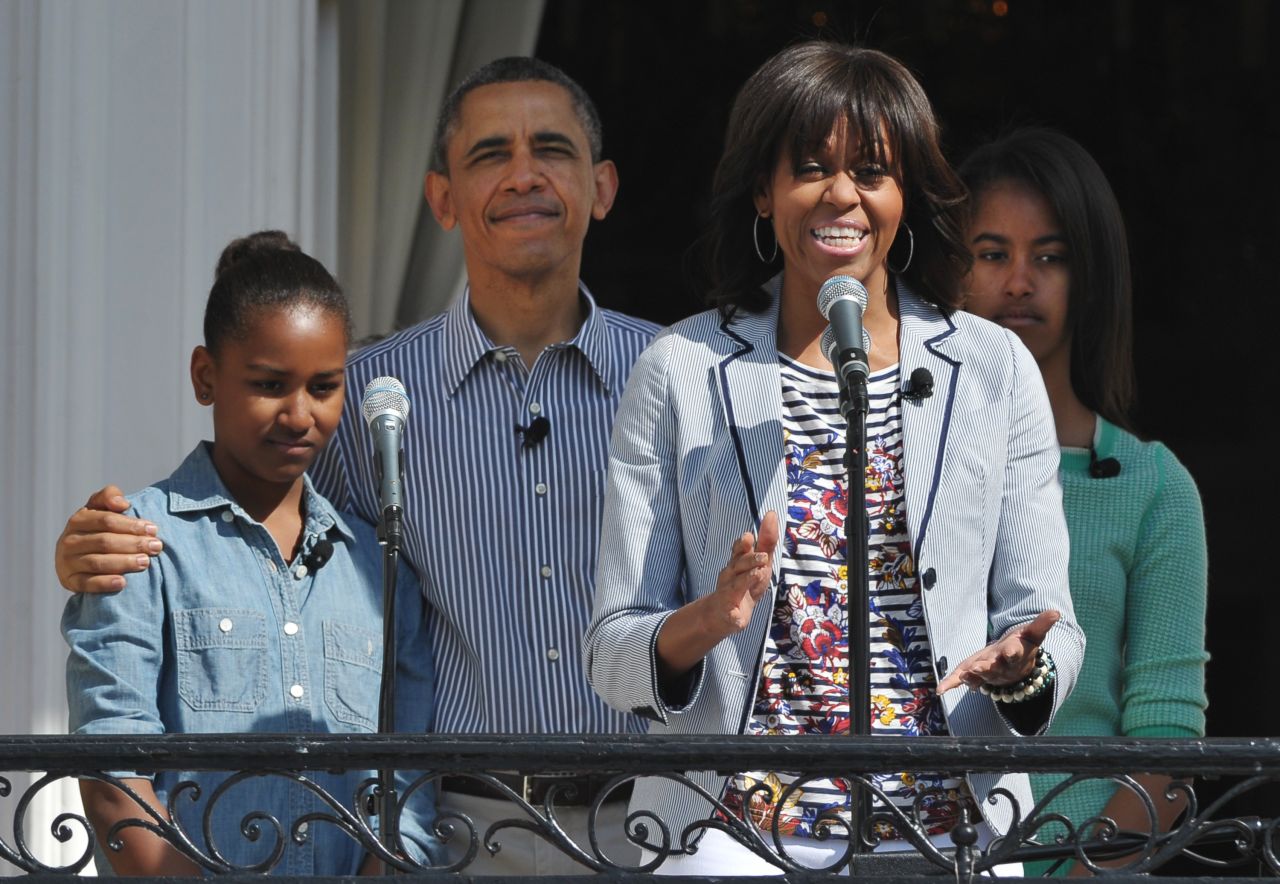 First lady Michelle Obama speaks as her family, Sasha, left, President Barack Obama, and Malia listen at the start of the annual event.