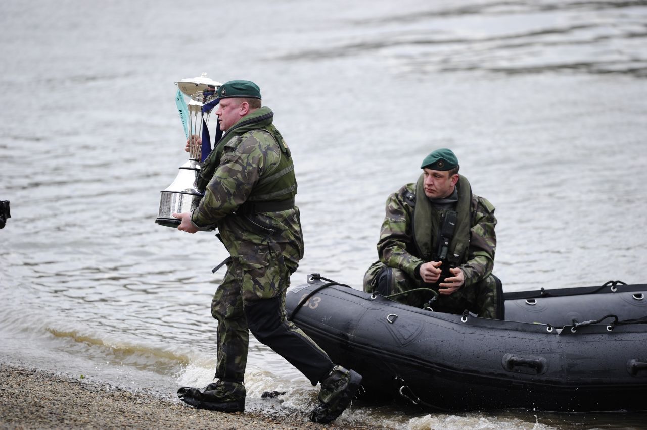 The British Royal Marines (pictured delivering the trophy) weren't taking any chances this year, patrolling the course armed with thermal imaging equipment.  