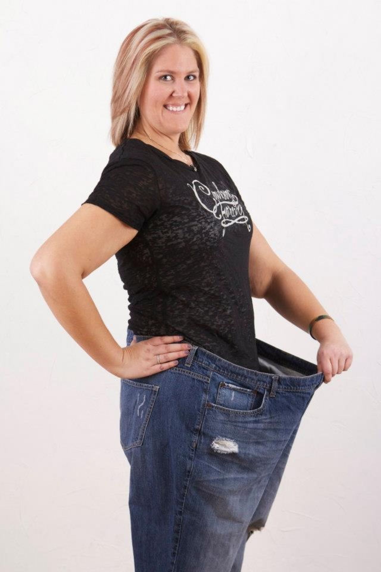 Tomsche used to wear a size 26 pant. Now she wears a size 14.