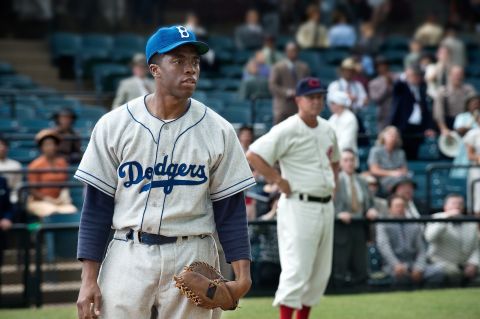 Chadwick Boseman stars as Jackie Robinson, the first African-American to play for a Major League Baseball team, in Brian Helgeland's "42." Harrison Ford plays Branch Rickey, the Brooklyn Dodgers' general manager who made history signing Robinson, in the biographical film.