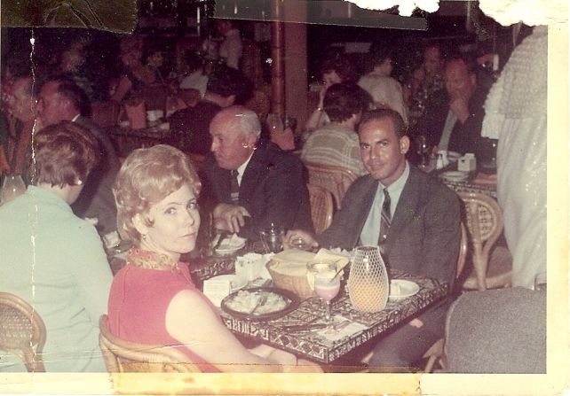 <a href="index.php?page=&url=http%3A%2F%2Fireport.cnn.com%2Fdocs%2FDOC-948004">Teri Coley Adams' parents</a> enjoy an evening in Oahu, Hawaii, in 1969. Her dad is wearing a thin striped tie and a sports jacket. Her mom has on a red linen dress with a matching satin red peacock scarf. "As I recall, the dress was pretty short, well above Mom's knees, but she had the legs for it," Adams says.