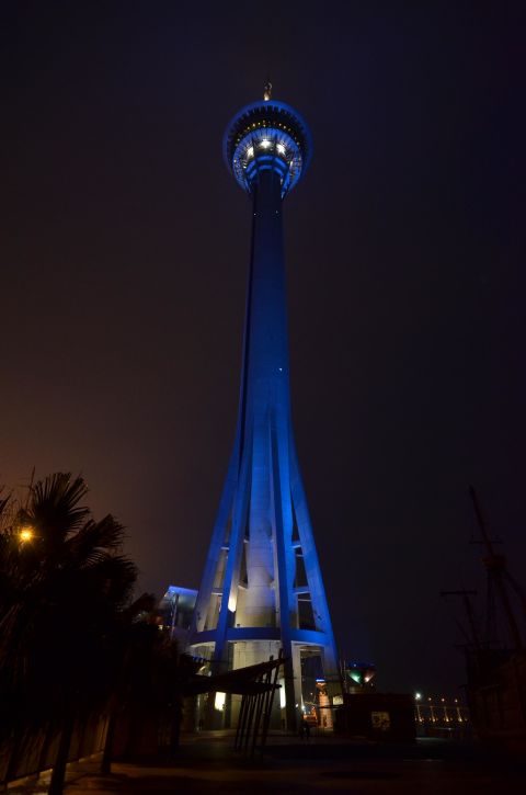 The Macau Tower next to the Pearl River in China lights up blue for the 2012 World Autism Awareness Day. 