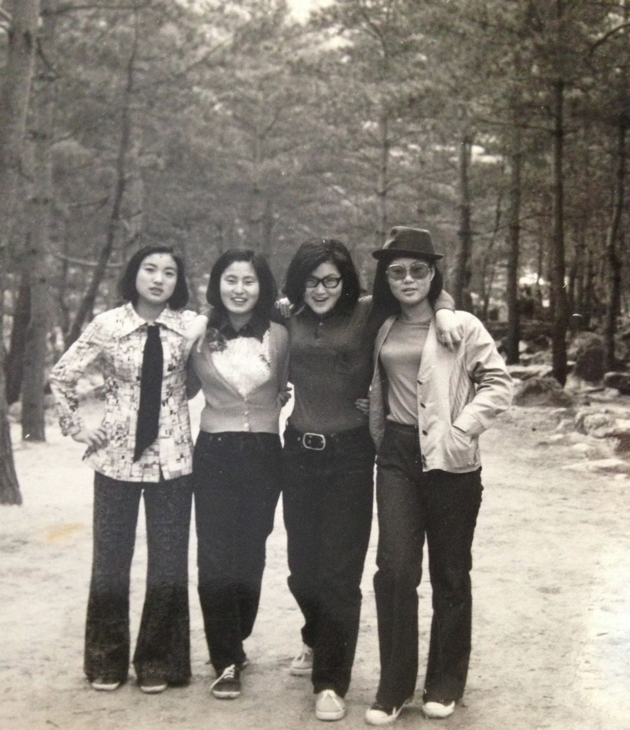 <a href="http://ireport.cnn.com/docs/DOC-948735">Dominica Lim's mom</a>, far left, wears a tie and bell-bottom pants as she poses for a picture with her friends in South Korea in 1969. "I think the fashion of the 1960s was very classy with a touch of fun," Lim says.