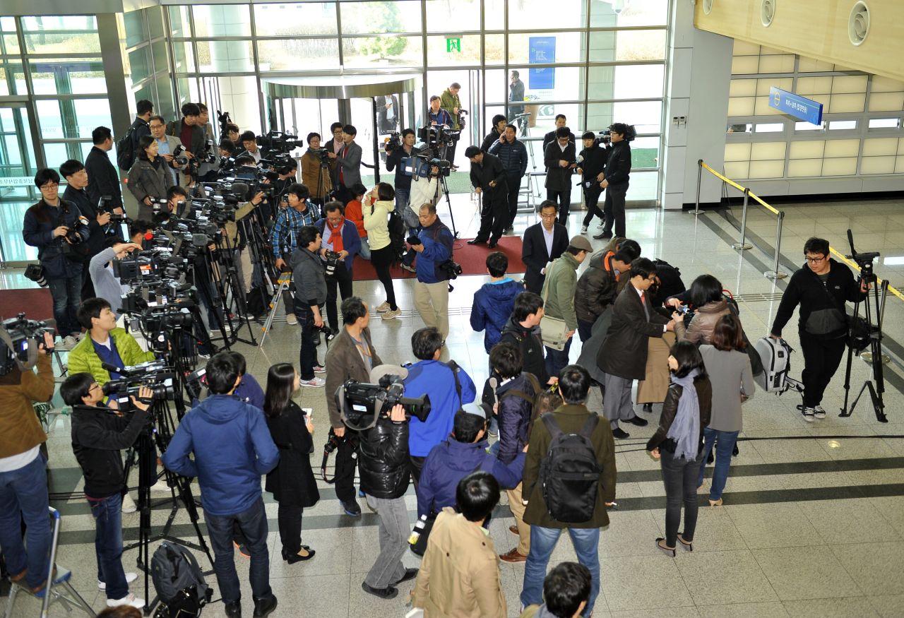 Reporters gather in front of customs at the Inter-Korean Transit Office in Paju in April.